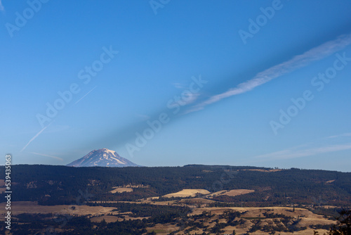 Mount Adams with a jet stream above it