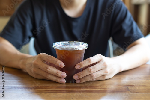 person with cup of coffee
