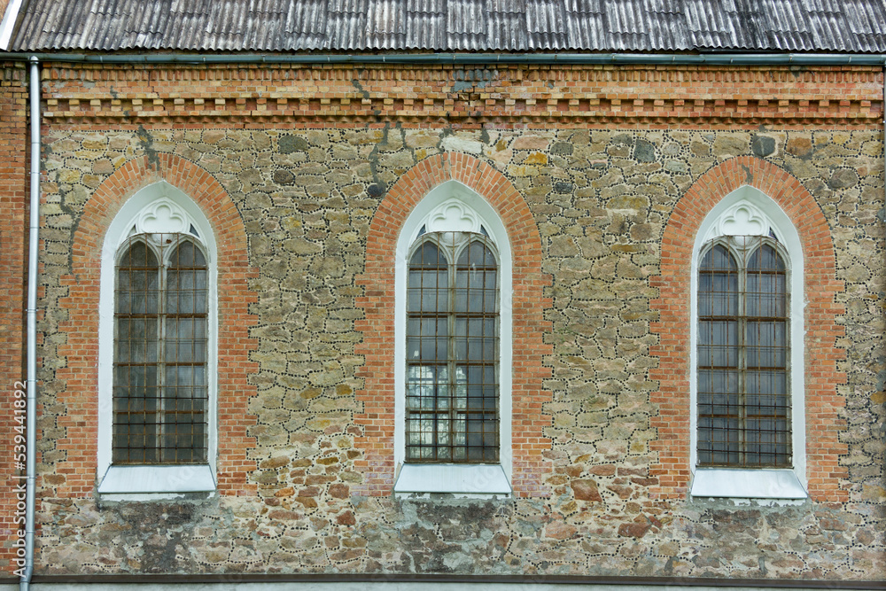 Old arch windows in a church wall