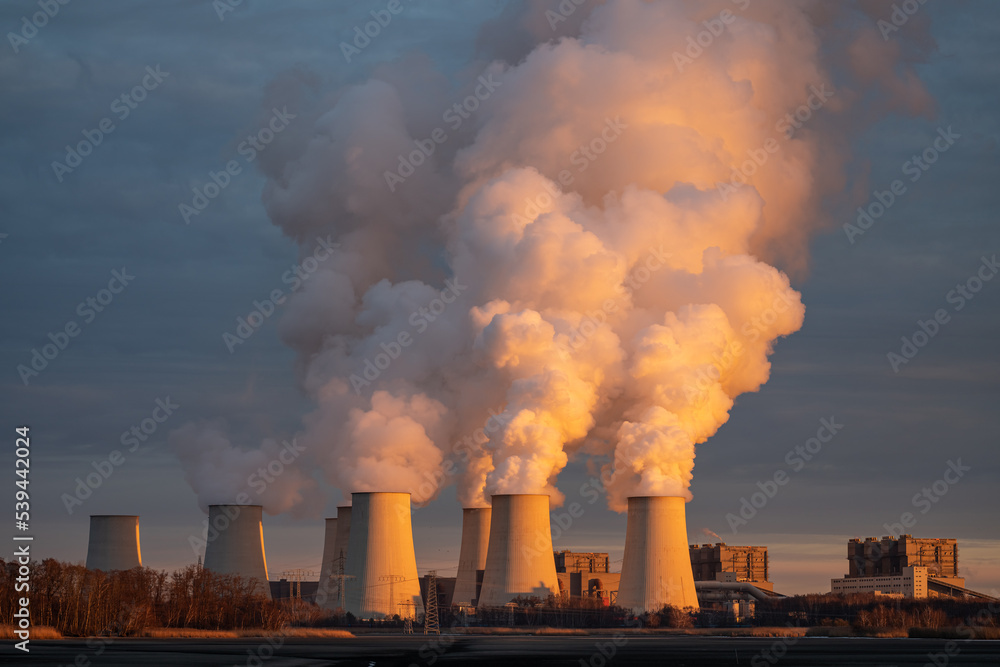 Smoking pipes of thermal power plant on sunset. Smoking pipes of thermal power plant on sunset.