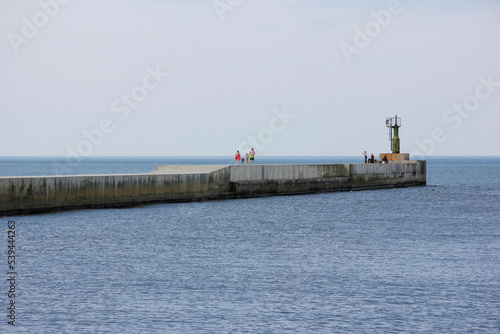 Baltic sea beach and pier in Pavilosta, Latvia