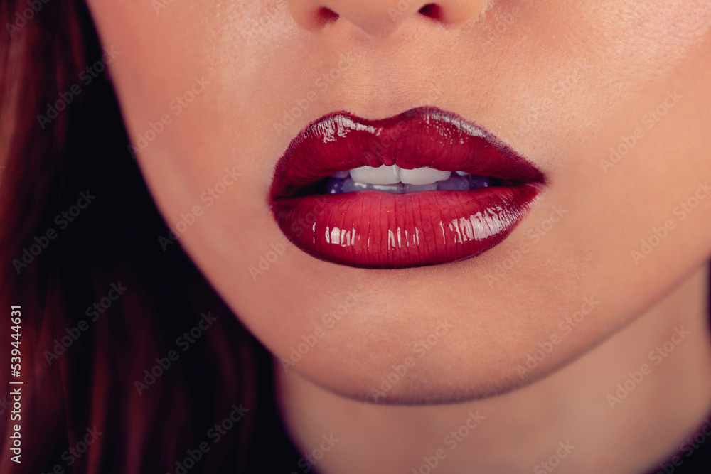 woman with glossy red lipstick close up 
