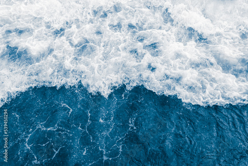 Dark blue sea ocean large, big wave and liquid white foam