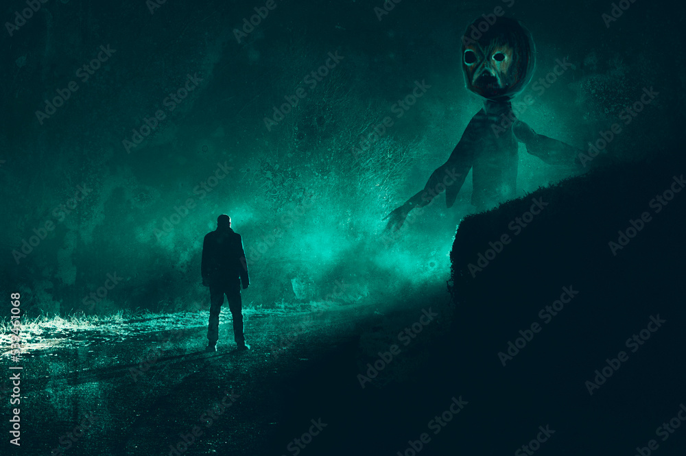 A horror concept of a scary giant pumpkin head. Standing in front a man. On a spooky road on a foggy winters night. A horror concept of a scary giant pumpkin head. Standing in front a man. On a spooky road on a foggy winters night.