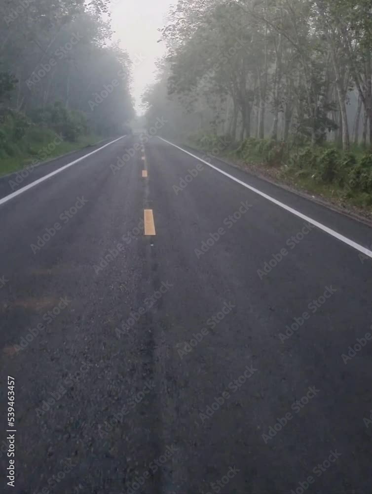 Driving on paved roads in the countryside a route in Thailand Along the way, the fog came down so thick that it was almost impossible to see. Driving on paved roads in the countryside a route in Thailand Along the way, the fog came down so thick that it was almost impossible to see.