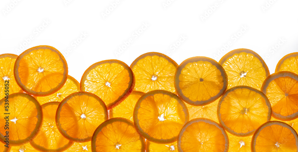 a bunch of shiny orange slices isolated on a white background for banner, border, panorama a bunch of shiny orange slices isolated on a white background for banner, border, panorama
