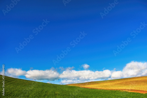 A beautiful landscape in minimal, with blue sky with whie clouds