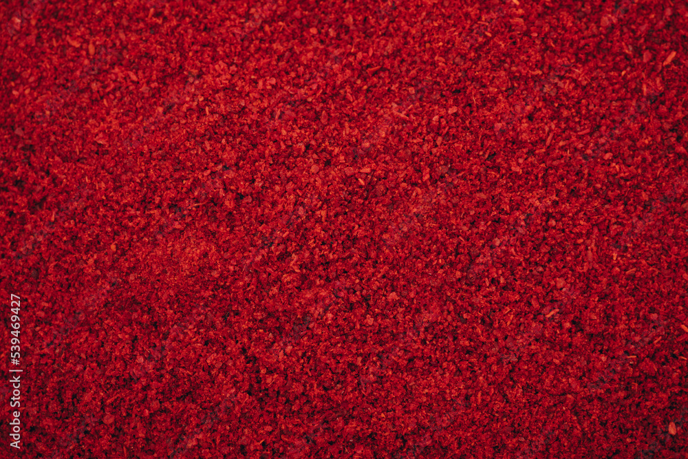 Chilli powder. Smoked chilli paprika. Red chilli powder paprika background.