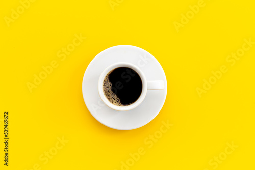 Fotografija White cup of hot espresso coffee. Morning routine concept