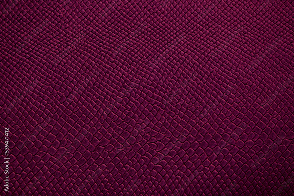 Fototapeta premium Beautiful bright eco-leather, animal skin texture in purple color, close-up as a background.
