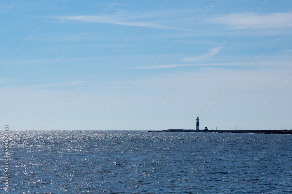 Lighthouse next to ocean Lighthouse next to ocean