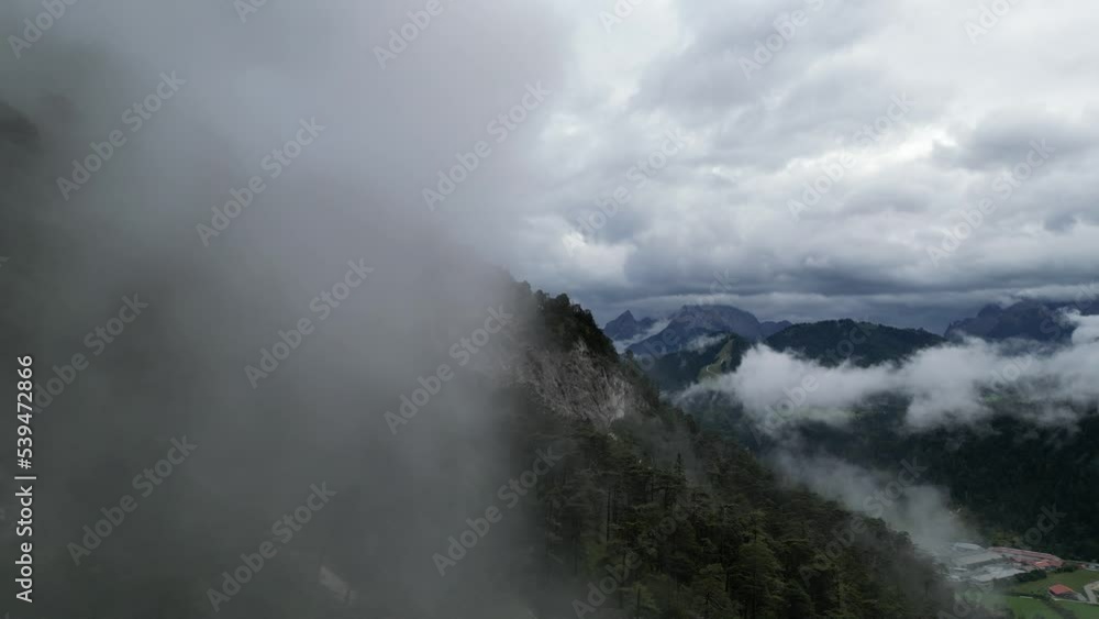 Drone flying through low cloud Bavaria Germany Drone flying through low cloud Bavaria Germany