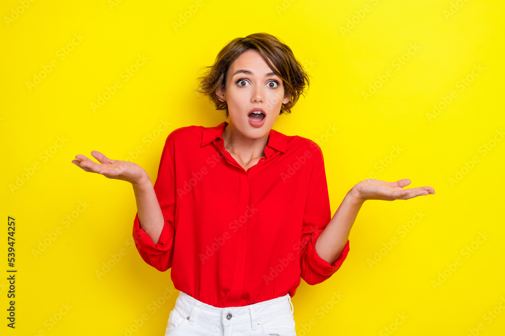 Portrait of adorable impressed woman with bob hairdo wear red shirt unbelievable unexpected reaction isolated on yellow color background Portrait of adorable impressed woman with bob hairdo wear red shirt unbelievable unexpected reaction isolated on yellow color background