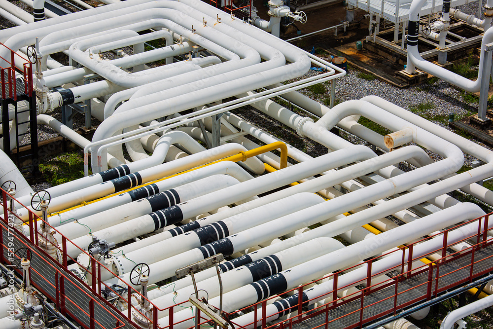 Steel long pipes and pipe elbow in station oil factory during refinery Petrochemistry industry Steel long pipes and pipe elbow in station oil factory during refinery Petrochemistry industry
