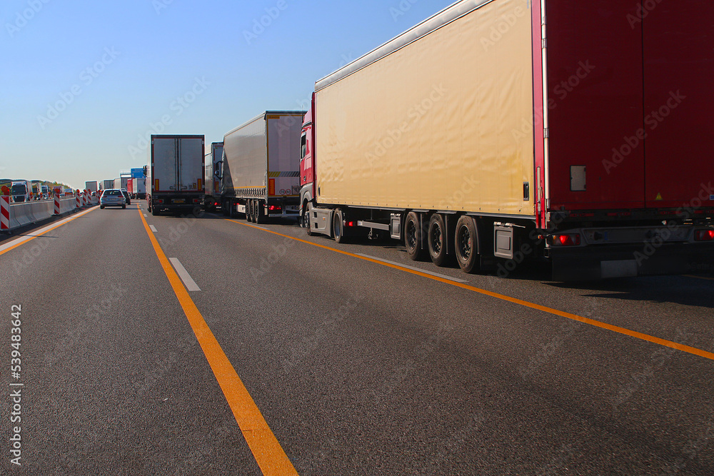 Slow-moving lorry traffic on right lane and jam on left lane due to roadworks (A6, near Pforzheim, Germany)