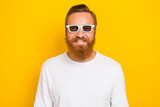 Photo of funky beard ginger man wear eyewear white shirt isolated on yellow color background