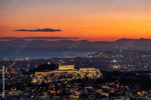 View of The Acropolis of Athens with the Parthenon seen from Mount Lycabettus after sunset.