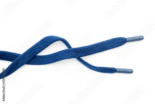 Dark-blue, blue sneakers shoelaces isolated on white, crumpled laces, top view. photo