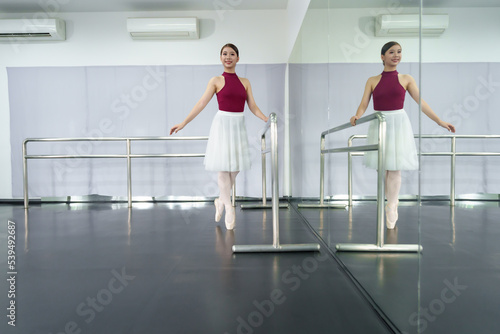 Female ballet dancers rehearse in ballet classes, they practice dancing, they are professional theater actors.