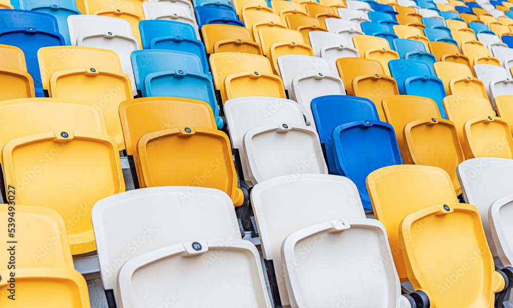 Fototapeta premium Empty stadium seats with the raised lids.
