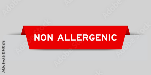 Red color inserted label with word non allergenic on gray background