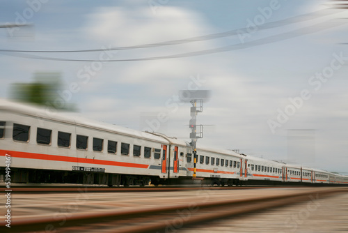 Motion blur of passanger train moving on railroad