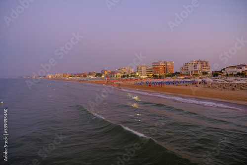 Coastline and city skyline at sunset in Senigallia, Marche, Italy. City background