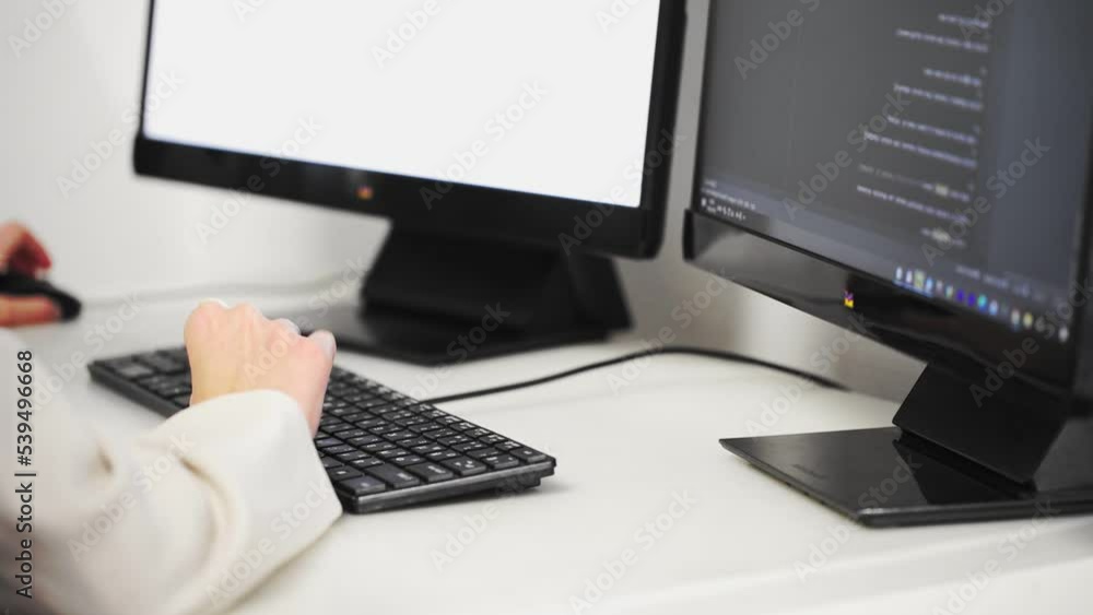 Scrolling the HTML web page code. Young female programmer Scrolling the HTML web page code. Young female programmer
