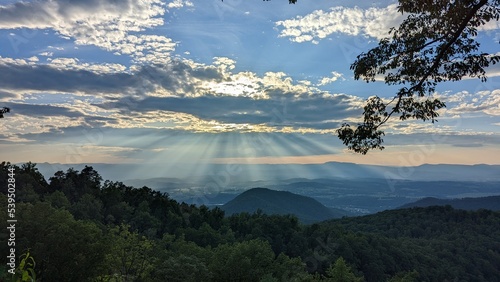 sun rays over valley