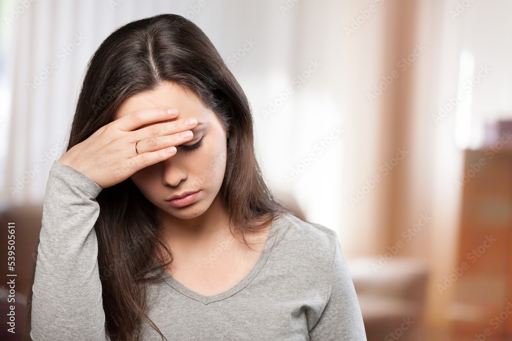 Depressed sad woman with head pain Depressed sad woman with head pain