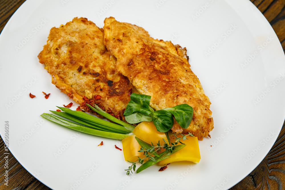 baked meat, grilled chicken on a wooden table
baked meat, grilled chicken on a wooden table