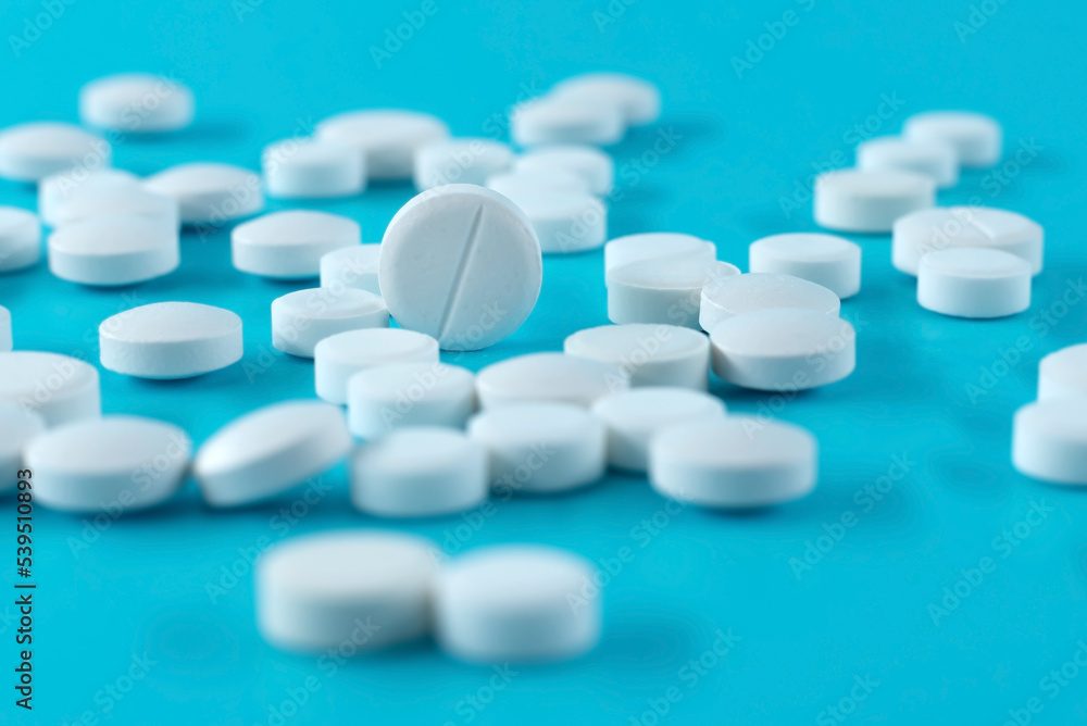 Medical pills on a blue background. Medical preparations. Health