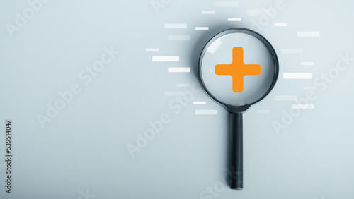 Cuadro en lienzo Magnifying glass focus on Plus sign and minus sign around