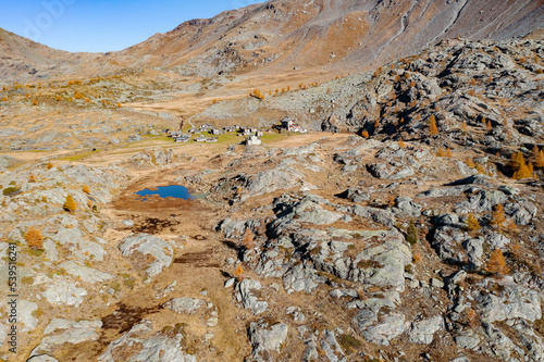 Valmalenco in Italy, aerial view of the area under Pizzo Scalino in autumn, Refuge Cristina photo