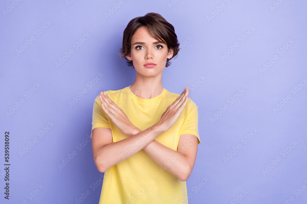 Photo of young adorable gorgeous nice woman serious wear yellow t-shirt crossed hands no stop symbol isolated on purple color background Photo of young adorable gorgeous nice woman serious wear yellow t-shirt crossed hands no stop symbol isolated on purple color background