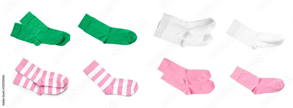 Set with pairs of different color socks on white background, top view. Banner design