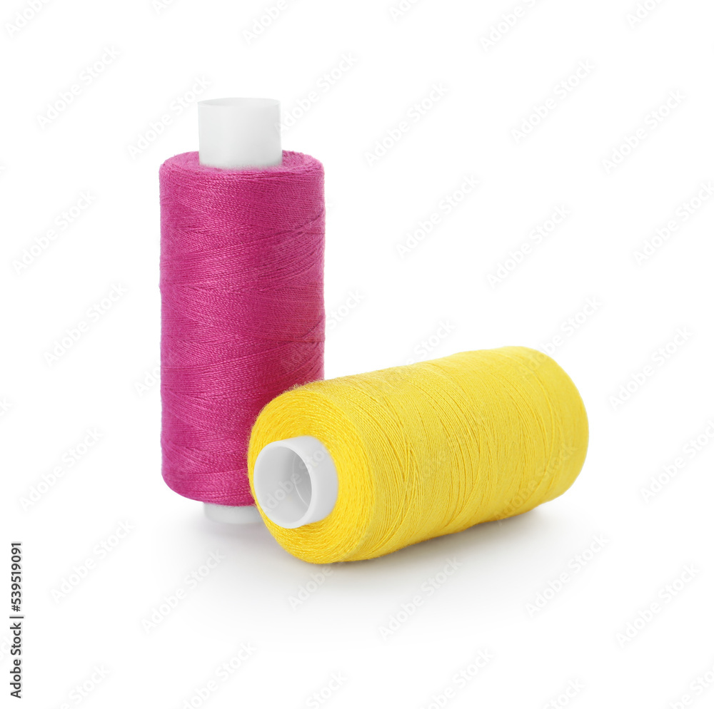 Different colorful sewing threads on white background Different colorful sewing threads on white background