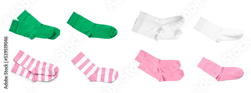 Set with pairs of different color socks on white background, top view. Banner design