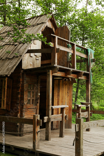 Old wooden hut in beautiful tranquil forest