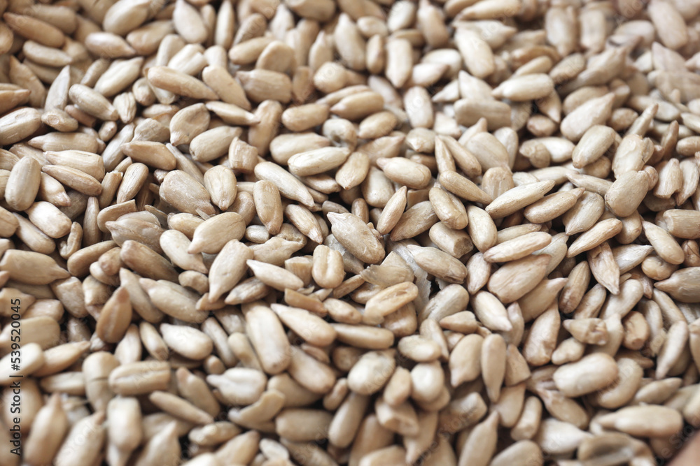 Organic sunflower seeds on table, closeup view Organic sunflower seeds on table, closeup view