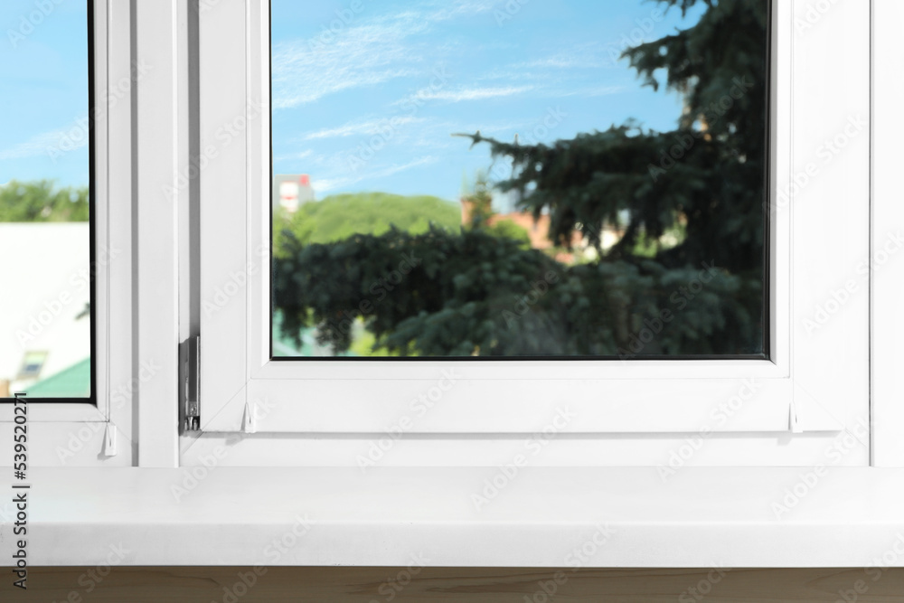 Fototapeta premium Window with empty white sill, closeup view