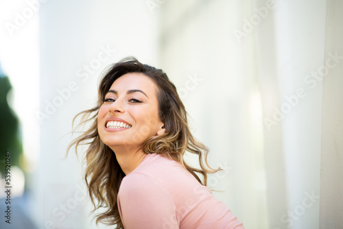 Close up happy young woman smiling © mimagephotos