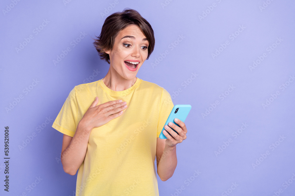 Portrait of impressed crazy lady use telephone read unexpected news isolated on purple color background Portrait of impressed crazy lady use telephone read unexpected news isolated on purple color background