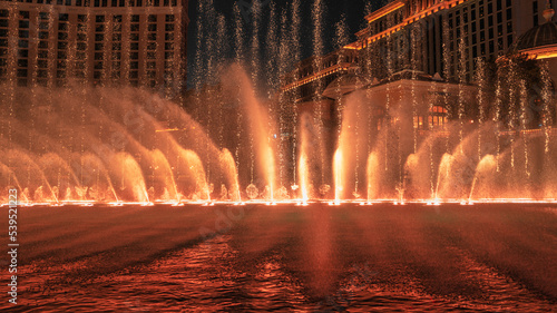 Las Vegas City Nightscape with red night water fountain display in Nevada, USA
