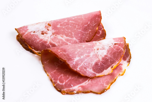 Sliced pork ham on a white background. Shallow depth of field