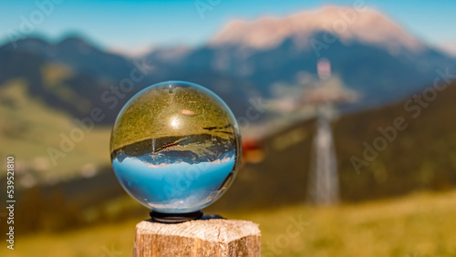 Crystal ball alpine summer landscape shot at Fieberbrunn, Tyrol, Austria
