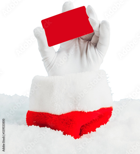 Santa Claus hand holding blank red plastic credit card against light blue bokeh background. Shopping, Sales, Giving Gift for Black Friday, Santas hand sticking out of a snowdrift. Christmas and New Ye