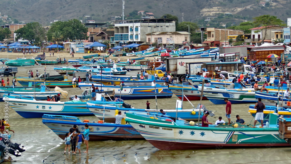 Fishing fleet on the beach in the harbor in Puerto Lopez, Ecuador