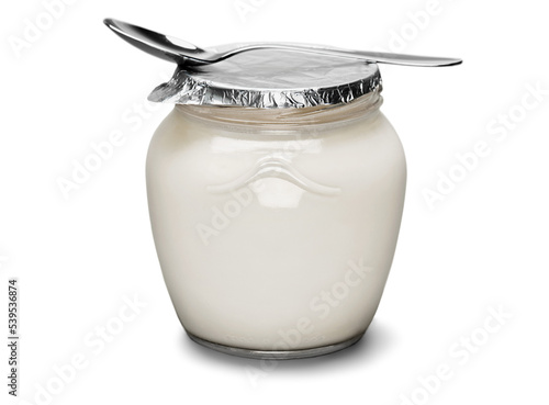 Fresh yogurt with spoon on light background