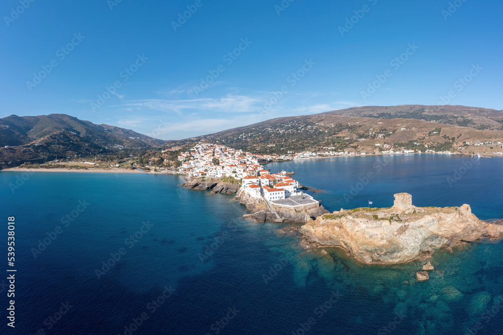 Andros Island, Greece. Traditional buildings on cape. Chora town aerial view.